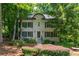 Charming two-story traditional home with well-manicured landscaping and shuttered windows at 799 Birds Se Ml, Marietta, GA 30067