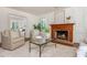 Cozy living room with fireplace, hardwood floors, neutral decor, and comfortable seating at 799 Birds Se Ml, Marietta, GA 30067