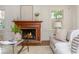 Inviting living room with fireplace, hardwood floors, neutral decor, and comfortable seating at 799 Birds Se Ml, Marietta, GA 30067