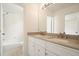 Bathroom with double vanity and large mirror at 1971 Wellesley Trce, Dunwoody, GA 30338
