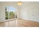 Bright bedroom with a large window offering pleasant views and hardwood floors at 1971 Wellesley Trce, Dunwoody, GA 30338