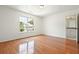 Spacious bedroom with hardwood floors and a large window at 1971 Wellesley Trce, Dunwoody, GA 30338