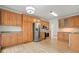 Open kitchen featuring stainless steel appliances and wood cabinetry at 1971 Wellesley Trce, Dunwoody, GA 30338