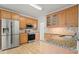 Bright kitchen with stainless steel appliances and granite countertops at 1971 Wellesley Trce, Dunwoody, GA 30338