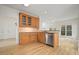 Kitchen area featuring a stainless steel dishwasher and wood cabinets at 1971 Wellesley Trce, Dunwoody, GA 30338