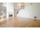 Open living area with fireplace, hardwood floors, staircase and lots of natural light at 1971 Wellesley Trce, Dunwoody, GA 30338