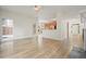Open-concept space with hardwood floors, seamlessly connecting living, dining, and kitchen areas at 1971 Wellesley Trce, Dunwoody, GA 30338