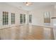 Bright living area with doors to backyard and windows, boasting natural light at 1971 Wellesley Trce, Dunwoody, GA 30338