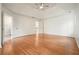 Spacious primary bedroom features tray ceiling, hardwood floors, and multiple windows at 1971 Wellesley Trce, Dunwoody, GA 30338