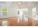 A main bedroom with hardwood floors, tray ceiling, and several windows at 1971 Wellesley Trce, Dunwoody, GA 30338