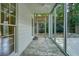 Sunroom with ceiling fan and tile floors at 1971 Wellesley Trce, Dunwoody, GA 30338