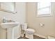 Half bathroom featuring modern fixtures, clean lines, and a minimalist design at 2102 Black Pebble Cir, Buford, GA 30519