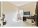 Bedroom with neutral carpet and walls, and a sunlit window view at 2102 Black Pebble Cir, Buford, GA 30519