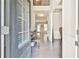 Inviting foyer with hardwood floors, neutral paint, and views into the formal dining and living spaces at 2102 Black Pebble Cir, Buford, GA 30519