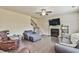 Cozy living room with hardwood floors, fireplace and large windows at 2102 Black Pebble Cir, Buford, GA 30519
