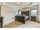 Relaxing main bedroom with tray ceiling, plush carpet and abundant natural light at 2102 Black Pebble Cir, Buford, GA 30519