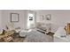 Cozy Bedroom with crib, rocking chair, and soft decor, bathed in natural light from the window at 5453 Baybrook Cir, South Fulton, GA 30349