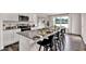 Modern kitchen with granite countertops, stainless steel appliances, and an island with bar stool seating at 5453 Baybrook Cir, South Fulton, GA 30349
