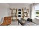 Well-lit home office with desk, comfortable seating, and stylish shelving with space to work and create at 5453 Baybrook Cir, South Fulton, GA 30349