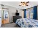 Bedroom featuring a TV, dresser, door to hallway, and a door to an outdoor balcony at 1445 Monroe Ne Dr # F12, Atlanta, GA 30324