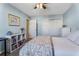 Bedroom featuring light blue walls, a double bed, and a white bookcase at 1445 Monroe Ne Dr # F12, Atlanta, GA 30324