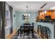 Charming dining room featuring a modern light fixture and bar-top kitchen access at 1445 Monroe Ne Dr # F12, Atlanta, GA 30324