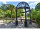 Detailed gazebo with seating offers a peaceful spot to sit near a pool in this welcoming community at 1445 Monroe Ne Dr # F12, Atlanta, GA 30324