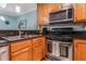 Close-up of kitchen with granite countertops and stainless steel appliances at 1445 Monroe Ne Dr # F12, Atlanta, GA 30324