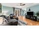 Cozy living room features hardwood floors, ceiling fan, and access to a balcony at 1445 Monroe Ne Dr # F12, Atlanta, GA 30324