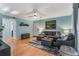 Inviting living room featuring hardwood floors, a sectional sofa, and neutral decor at 1445 Monroe Ne Dr # F12, Atlanta, GA 30324