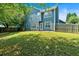 Two-story home with a spacious backyard, perfect for entertaining and relaxing outdoors at 254 Wood Duck Dr, Jonesboro, GA 30238