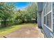Beautiful backyard with green grass, a wooden fence, and a patio area at 254 Wood Duck Dr, Jonesboro, GA 30238