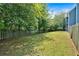 Large backyard with lush green grass and privacy fence, great for outdoor activities at 254 Wood Duck Dr, Jonesboro, GA 30238