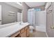 Bathroom boasts a vanity with drawers, a shower-tub combo, and a tiled floor at 254 Wood Duck Dr, Jonesboro, GA 30238