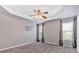 Carpeted bedroom featuring two windows and neutral walls at 254 Wood Duck Dr, Jonesboro, GA 30238