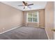 Bedroom with neutral walls, carpet floors, and a ceiling fan for added comfort at 254 Wood Duck Dr, Jonesboro, GA 30238