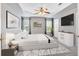 Bright and airy primary bedroom featuring a tray ceiling and natural light at 254 Wood Duck Dr, Jonesboro, GA 30238