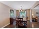 Traditional dining room features wood flooring, complementary furnishings and a large window to the yard at 254 Wood Duck Dr, Jonesboro, GA 30238