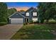 Charming two-story home with a well-manicured lawn and an attached two-car garage at 254 Wood Duck Dr, Jonesboro, GA 30238
