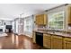 Efficient kitchen with ample counter space, wood cabinets, and connection to a bright, inviting living area at 254 Wood Duck Dr, Jonesboro, GA 30238