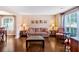 Bright living room with hardwood flooring, large window with natural light, and tastefully decorated furniture at 254 Wood Duck Dr, Jonesboro, GA 30238