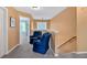 Cozy loft area with carpeted flooring, two armchairs and a window to the outside at 254 Wood Duck Dr, Jonesboro, GA 30238