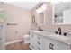 Main bathroom showcasing double sinks, marble countertop, and sleek fixtures at 254 Wood Duck Dr, Jonesboro, GA 30238