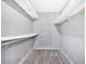 Spacious walk-in closet with carpet, shelving and hanging racks for optimal storage solutions at 254 Wood Duck Dr, Jonesboro, GA 30238