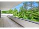 Exterior balcony showcasing lush greenery and a black railing offering great views and privacy at 3891 Wieuca Rd, Atlanta, GA 30342