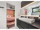 Contemporary bathroom view showing floating vanity and view into pink themed bedroom and walk-in closet at 3891 Wieuca Rd, Atlanta, GA 30342