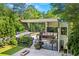 Modern home featuring expansive windows, clean lines, and nestled within mature trees for privacy and curb appeal at 3891 Wieuca Rd, Atlanta, GA 30342