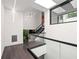 Modern hallway features glass railings, skylights, stylish lighting, and sleek design elements at 3891 Wieuca Rd, Atlanta, GA 30342