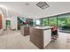 Open concept area highlighting kitchen island with modern appliances, barstool seating, and seamless living spaces at 3891 Wieuca Rd, Atlanta, GA 30342