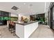Contemporary kitchen with an oversized island, barstool seating, and sleek, modern appliances and design at 3891 Wieuca Rd, Atlanta, GA 30342